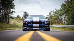 Ford Mustang Gt350r Roaring On Road Wallpaper