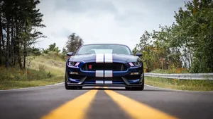 Ford Mustang Gt350r Roaring On Road Wallpaper