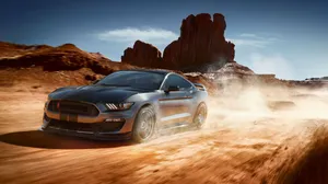 Ford Mustang Shelby Gt350 Roaring Its Power On The Road Wallpaper