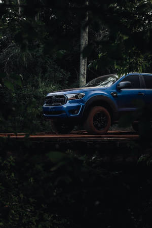 Ford Raptor In Dense Forest Wallpaper