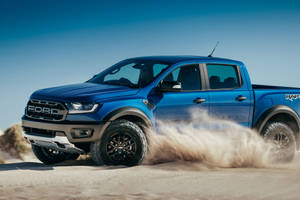 Ford Raptor In Metallic Blue Paint Wallpaper