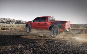 Ford Raptor Jumping Off Wallpaper