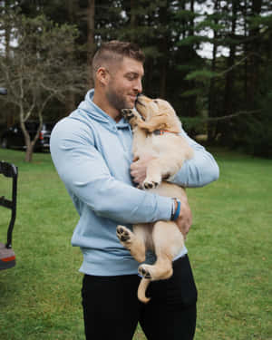 Former Nfl Quarterback, And Philanthropist Tim Tebow Wallpaper