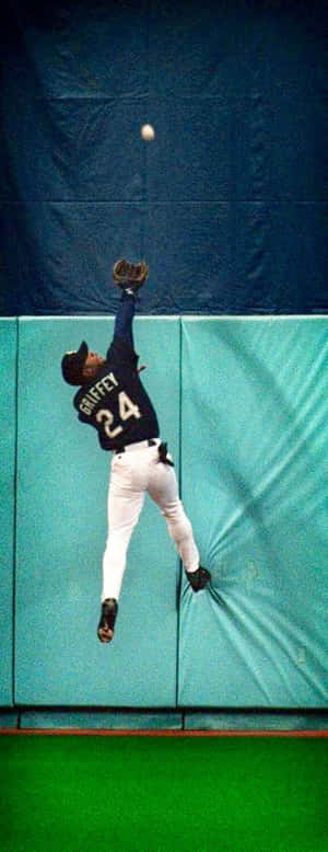 Former Seattle Mariners Superstar Ken Griffey Jr. Crushing A Homerun Wallpaper