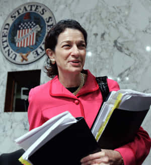 Former U.s. Senator Olympia Snowe Studying Documents Wallpaper