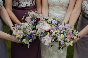 Four Bridesmaids With Flowers Wallpaper