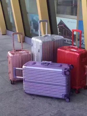 Four Rimowa Suitcases Wallpaper