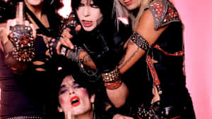 Four Women In Punk Outfits Posing For A Picture Wallpaper