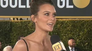 Frankie Shaw Striking A Pose On A Blue Background Wallpaper