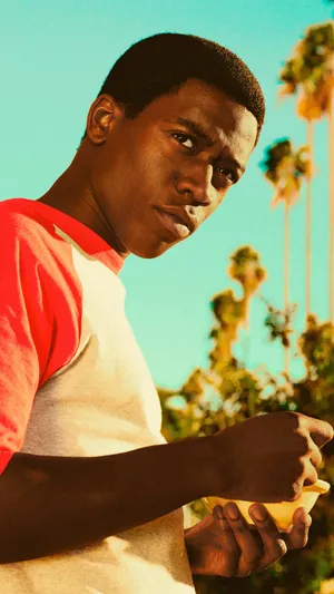 Franklin Saint Pensive Look Palm Trees Background Wallpaper