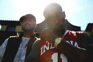 Freddie Gibbsand Friend Outdoors Wallpaper