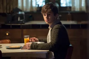 Freddie Highmore Eating Meal Wallpaper