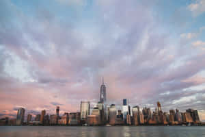 Freedom Tower New York Skyline Under Purple Clouds Wallpaper