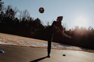 Freestyle Soccer Trickat Sunset Wallpaper