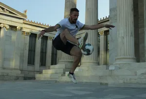 Freestyle Soccer Trickin Frontof Classic Architecture Wallpaper