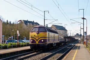 Freight Train Passing Schifflange Station Luxembourg Wallpaper