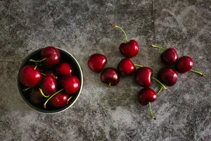 Fresh And Vibrant Red Cherries Wallpaper