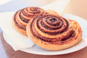 Fresh Baked Cinnamon Rollson Plate Wallpaper