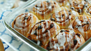 Fresh Baked Cinnamon Rollswith Icing Wallpaper