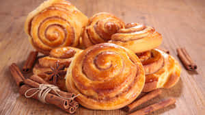 Fresh Baked Cinnamon Rollswith Spices Wallpaper