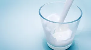 Fresh Dairy Milk Pouring Into A Glass Wallpaper