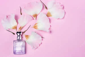 Fresh Floral Spring Perfume Bottles Surrounded By Blooming Flowers Wallpaper