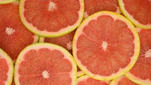 Fresh Pink Grapefruit Slices Close-up Wallpaper