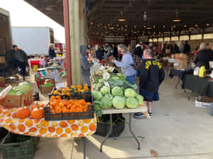 Fresh Produce At A Lively Farmers Market Wallpaper