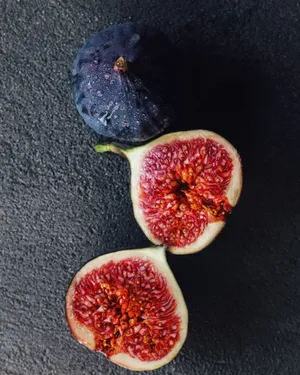 Fresh Purple Figs On A White Background Wallpaper