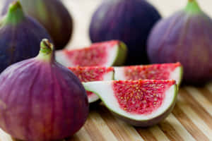 Fresh, Ripe Purple Figs Ready To Be Enjoyed._ Wallpaper