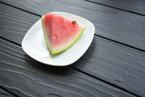 Fresh Watermelon Sliceon Plate Wallpaper