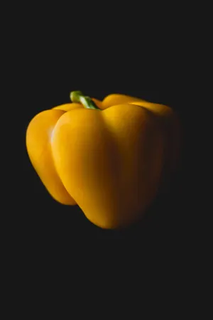 Fresh Yellow Bell Pepper On A Vibrant Background Wallpaper
