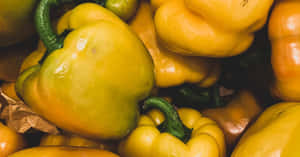 Fresh Yellow Bell Pepper On A Wooden Surface Wallpaper