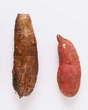 Fresh Yellow Sweet Potatoes On A Wooden Surface Wallpaper