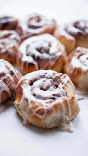 Freshly Baked Cinnamon Rollswith Icing.jpg Wallpaper