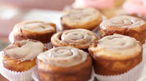 Freshly Baked Cinnamon Rollswith Icing Wallpaper