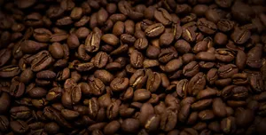 Freshly Brewed Brown Coffee With Aromatic Beans Wallpaper