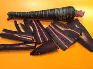 Freshly Picked Purple Carrots Picked From The Garden Wallpaper