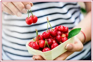 Freshly Picked Red Cherries On A Wooden Table Wallpaper