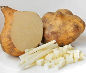 Freshly Prepared Jicama, Cut Into Strips And Mini Cubes Wallpaper