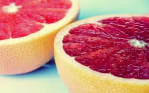 Freshly Sliced Pink Grapefruit Wallpaper