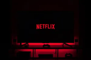 Friends Enjoying A Netflix Movie Night Wallpaper