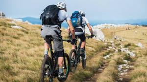 Friends Mountain Biking Towards Cap De Formentor Wallpaper