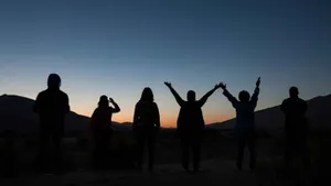 Friendship Day Silhouettesat Sunset Wallpaper