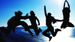 Friendship Jumping In Midair Wallpaper