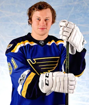 Front Portrait Of Vladimir Tarasenko Smirking While Holding Hockey Stick Wallpaper
