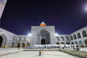 Front View Of Shah Mosque At Night Wallpaper