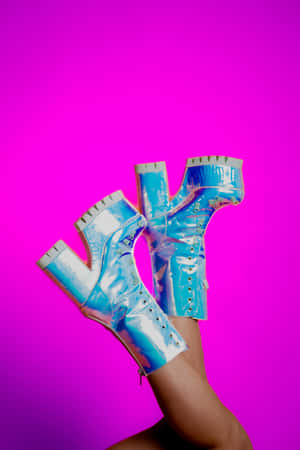 Futuristic Blue Bootson Pink Background Wallpaper