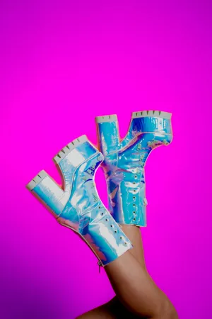 Futuristic Blue Bootson Pink Background Wallpaper