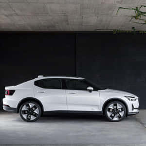 Futuristic Electric Vehicle On A Scenic Road Wallpaper